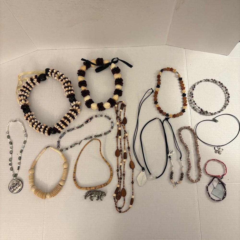 Lot of 17 Hawaiian inspired necklaces. Kukui Nut & Cowrie Shell Leis and more.